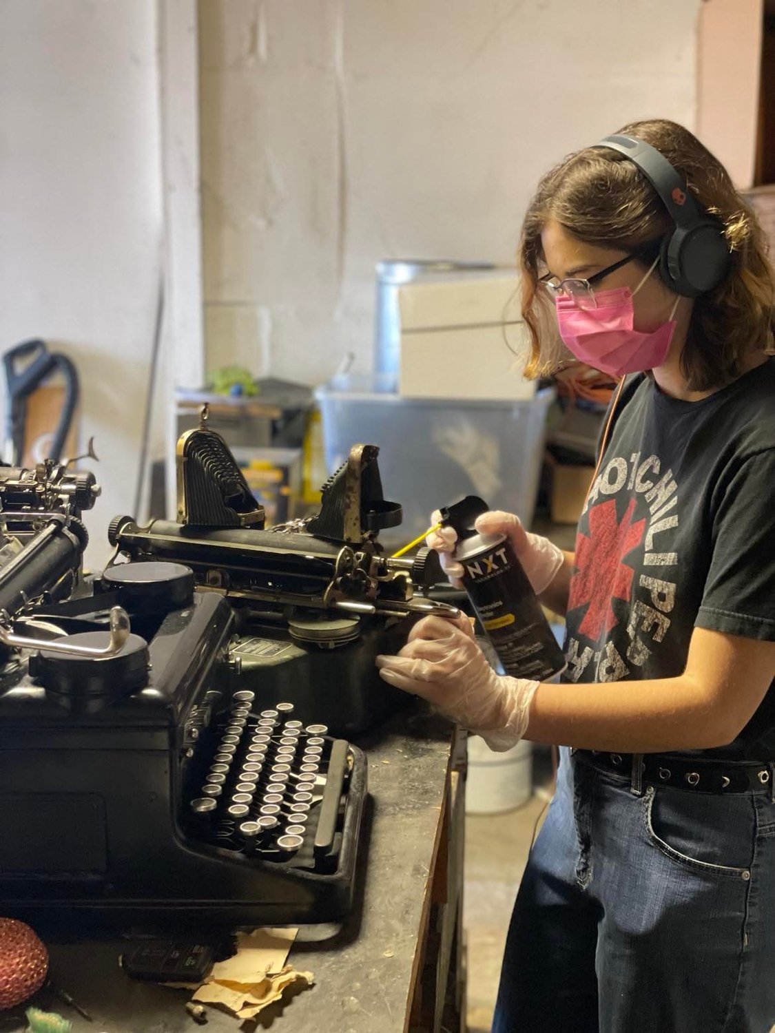 Jackie Ballard works on cleaning and repairing a typewriter at the Clare County Cleaver during her internership with the Cleaver as part of the Michigan Works! Region 7B Young Professionals Program.